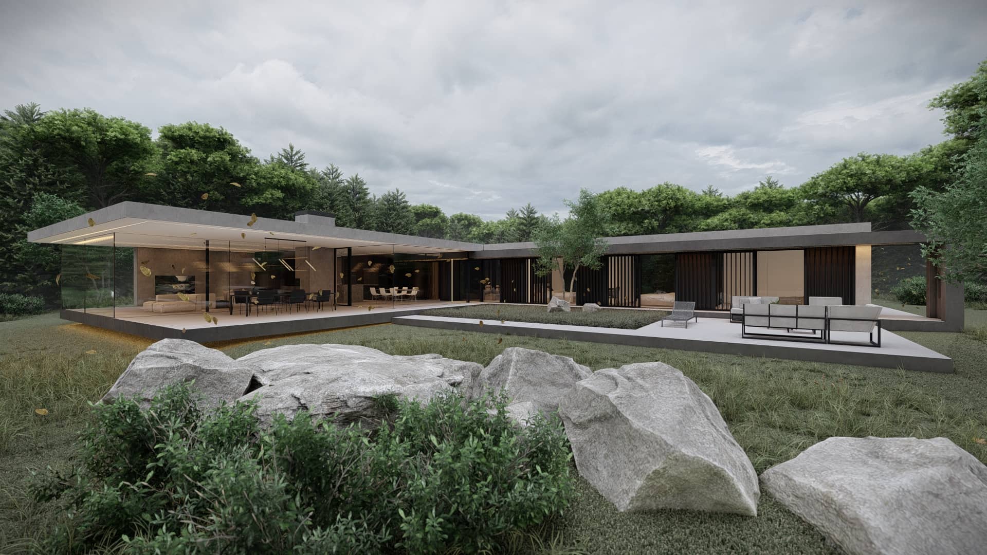 Moderne bungalow met glazen leefruimte, overdekt terras, strakke lijnen, grote rotspartijen en natuurlijke beplanting rondom de woning.