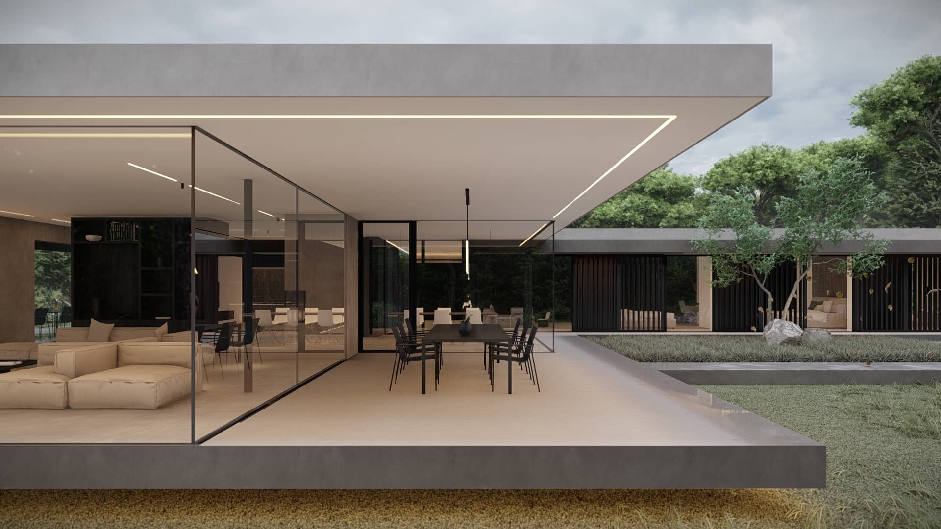 Overdekt terras met glazen schuifpuien, eethoek, lounge, grote dakoverstekken en zicht op een moderne bungalow met tuin.