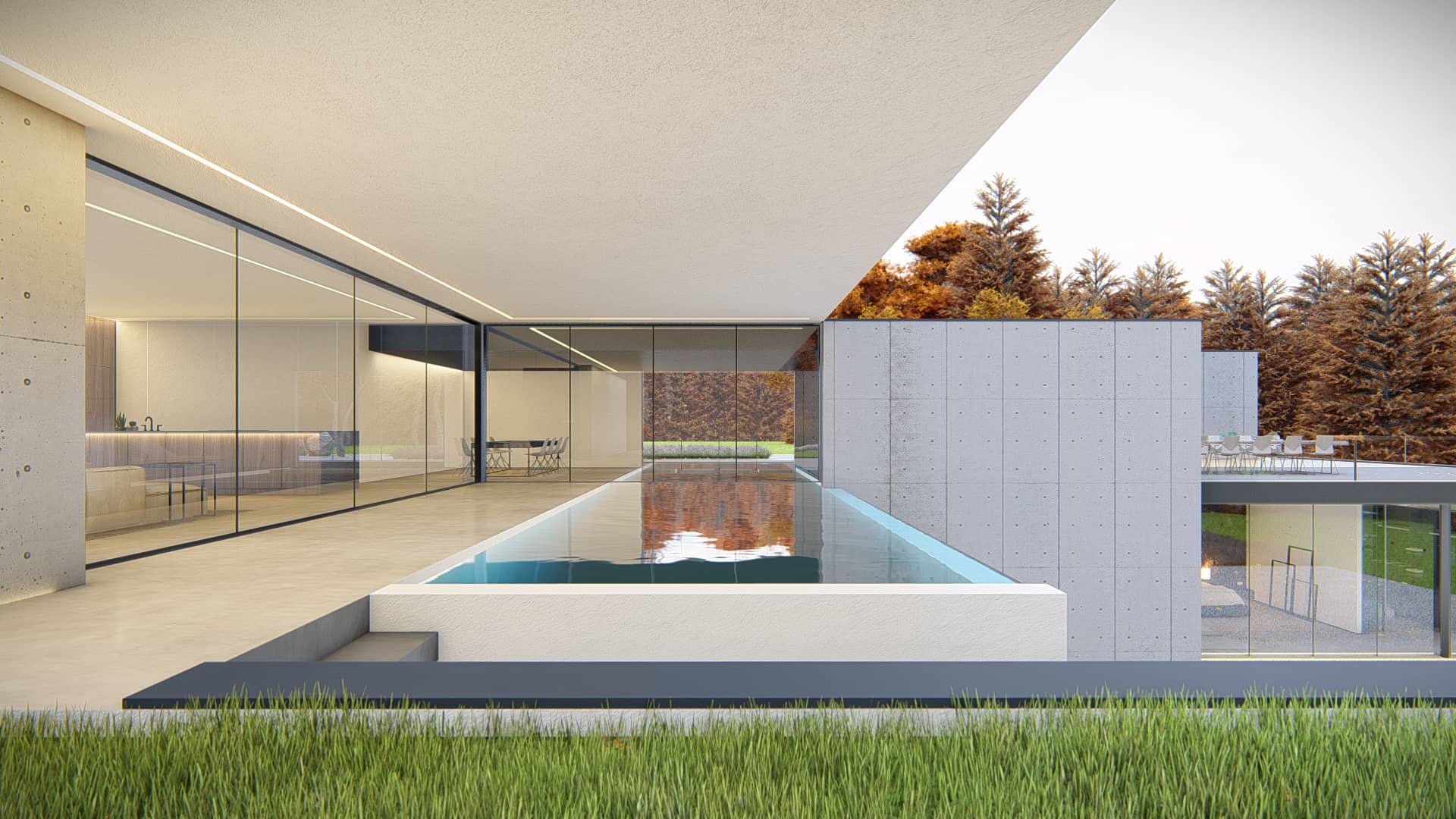 Moderne villa met geometrische witte gevel, groot terras en glazen bovenverdieping in een bosrijke omgeving.