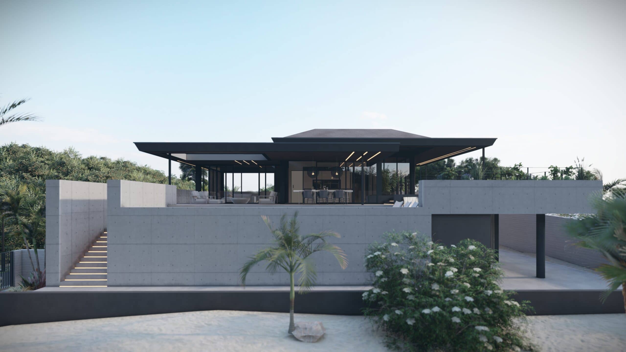 Verhoogde moderne villa met grote terrassen en tropische omgeving.