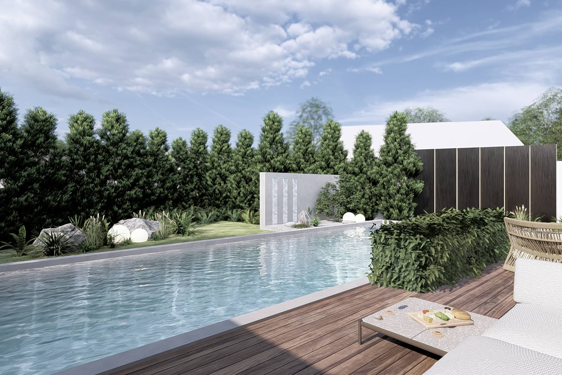 Zwembad en terras bij een moderne villa in Zeeland, omgeven door groen en zorgvuldig ontworpen buitenruimte.