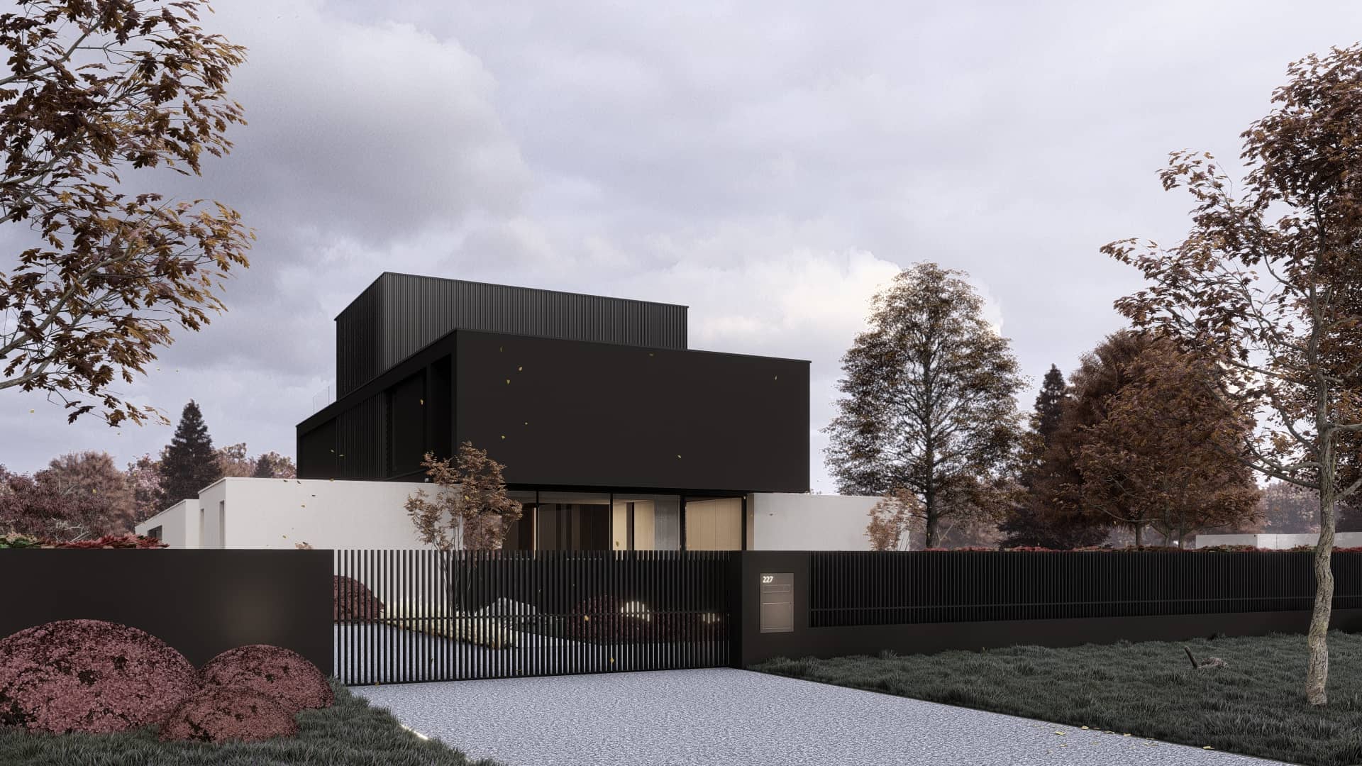 Moderne villa in Overijssel met krachtige zwarte volumes, strakke toegang en groene landschappelijke inpassing.