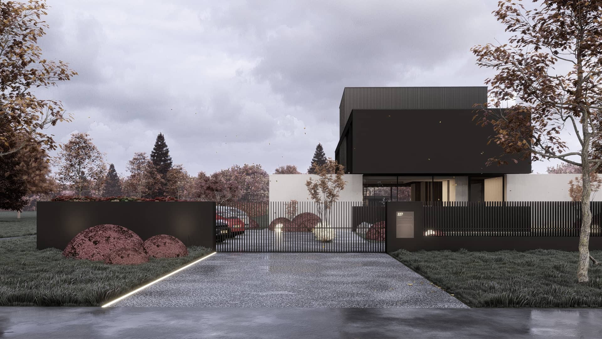 Moderne villa in Drenthe met donkere gevelvlakken, strakke volumes en geïntegreerde landschapsarchitectuur.